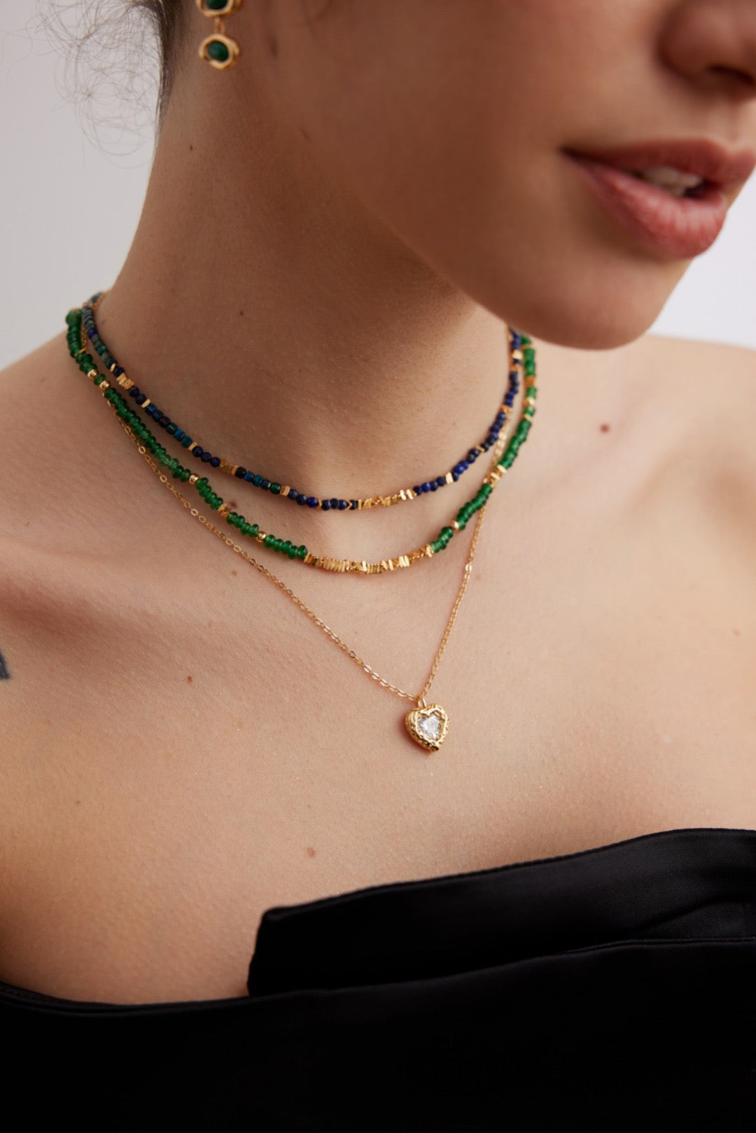 Collana con moneta di smeraldo