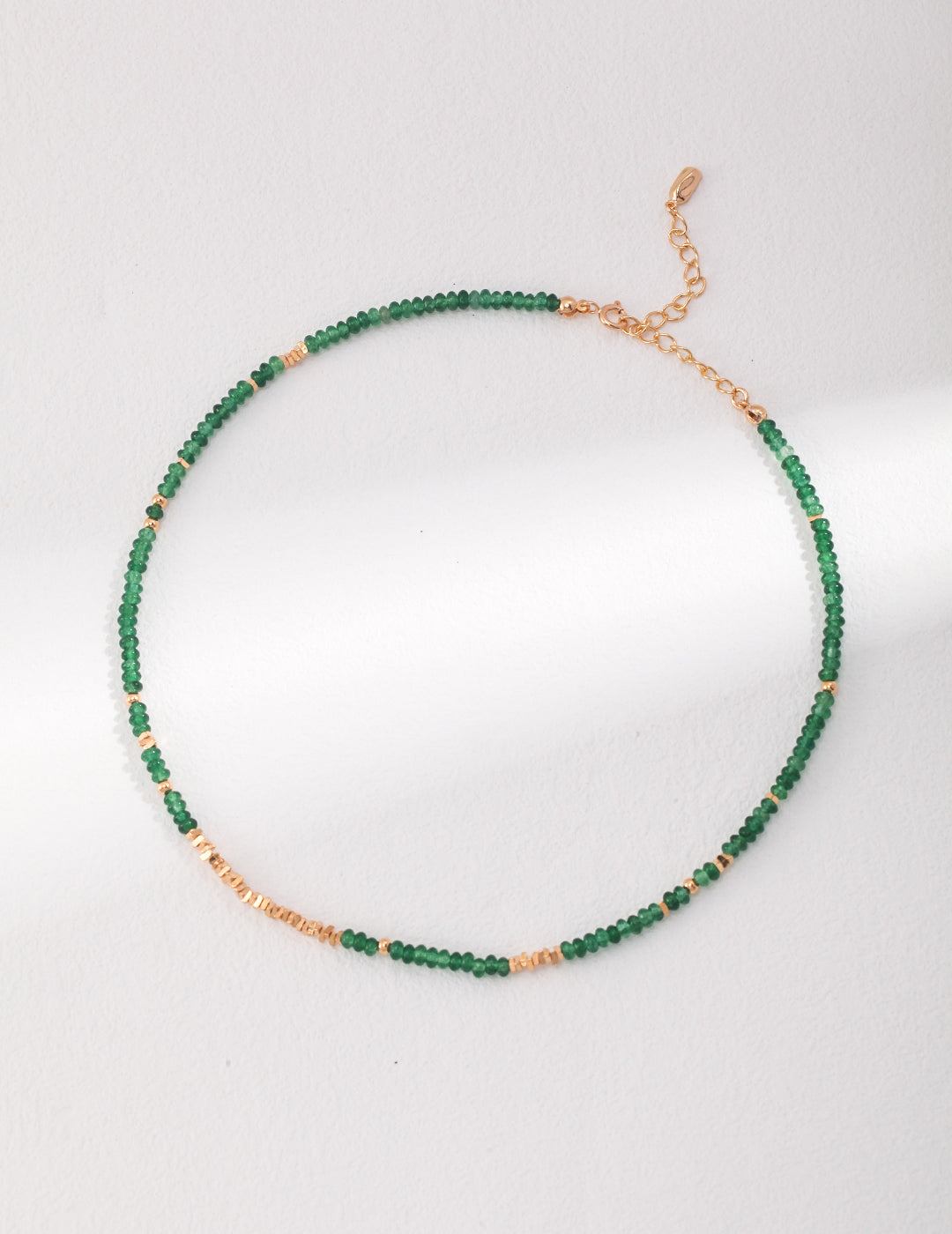 Collana con moneta di smeraldo