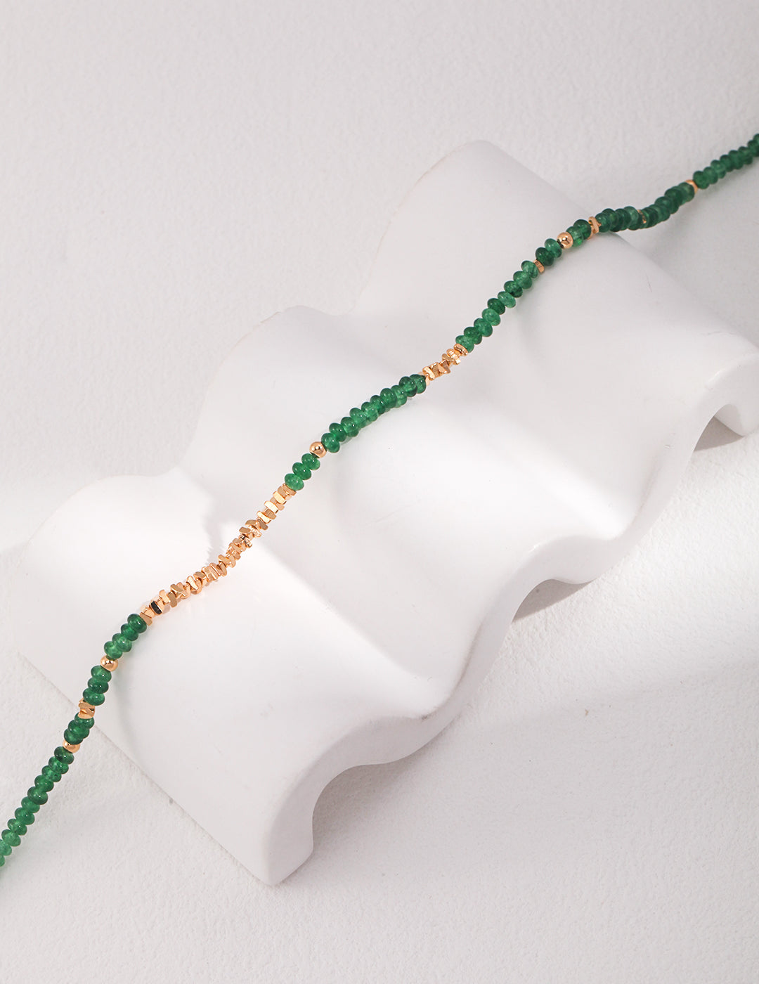 Collana con moneta di smeraldo
